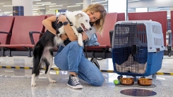 woman and dog in airport