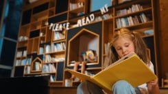 Girl reading in library