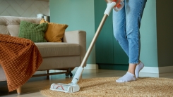 woman vacuuming a living room