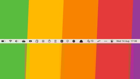 A screenshot of a Mac's cluttered menu bar against a rainbow-colored background. 